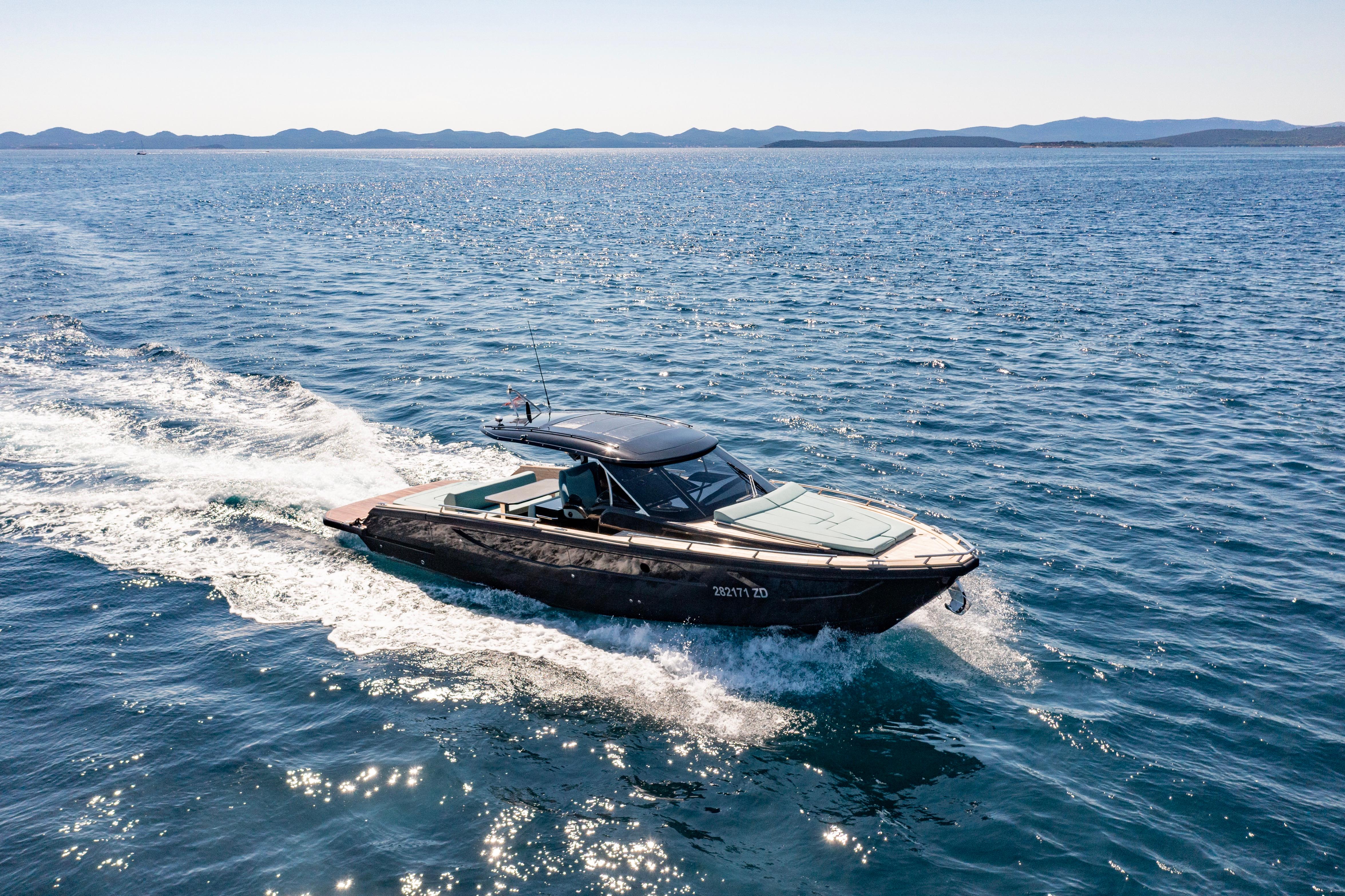 2023 Focus Forza 37 yacht cruising on open sea under clear skies.