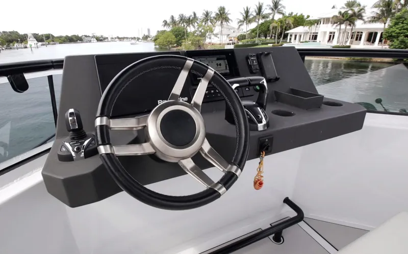  Yacht Photos Pics Helm of 2023 Custom Vandal Explorer 46 yacht with modern steering and controls.