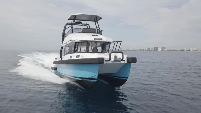  Yacht Photos Pics 2023 Custom Vandal Explorer 46 cruising on open water, showcasing sleek design and speed.