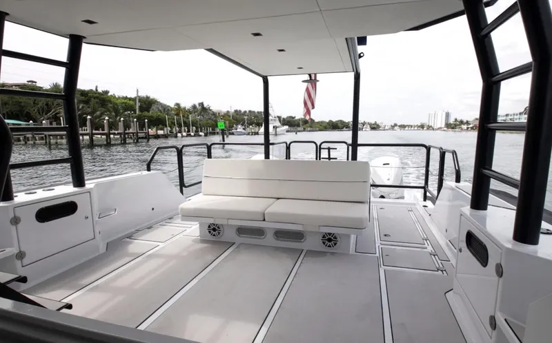  Yacht Photos Pics 2023 Custom Vandal Explorer 46 boat interior with white seating and waterfront view.