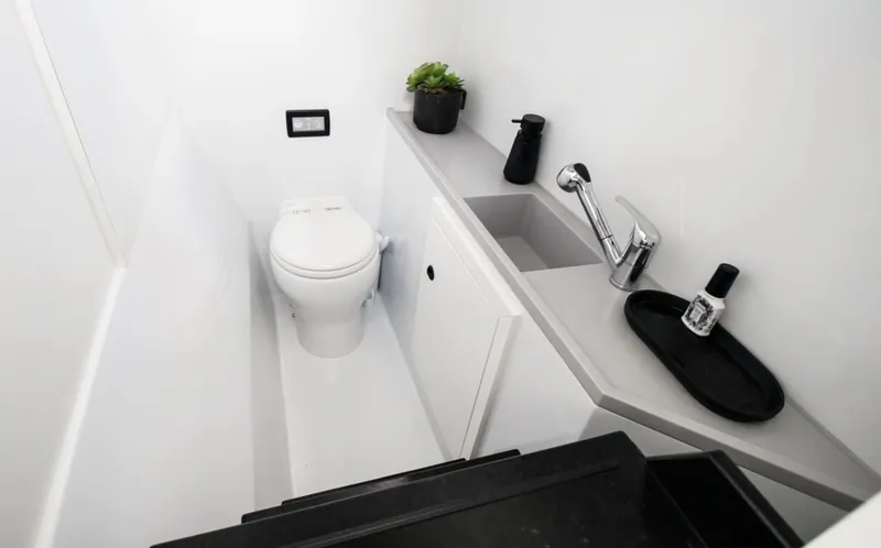  Yacht Photos Pics Modern bathroom in 2023 Vandal Explorer 46 yacht, featuring sleek fixtures and minimalist design.