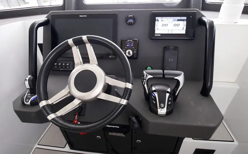  Yacht Photos Pics 2023 Custom Vandal Explorer 46 helm with steering wheel and navigation controls.