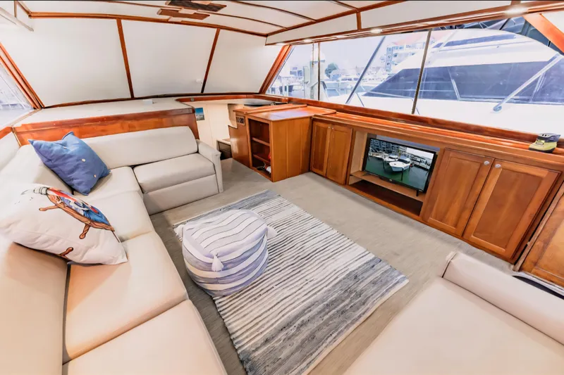  Yacht Photos Pics Luxurious interior of 1988 Ocean Yachts 48 Super Sport with cozy seating and elegant wood finishes.