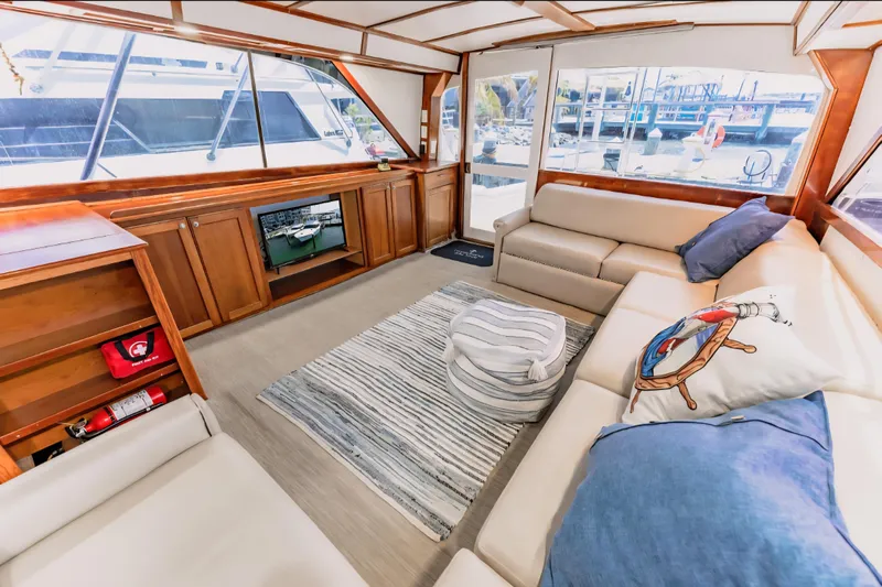  Yacht Photos Pics Luxurious interior of 1988 Ocean Yachts 48 Super Sport with cozy seating and nautical decor.