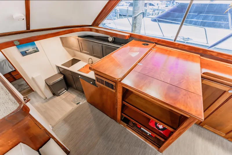  Yacht Photos Pics 1988 Ocean Yachts 48 Super Sport interior with wooden cabinetry and modern kitchen area.