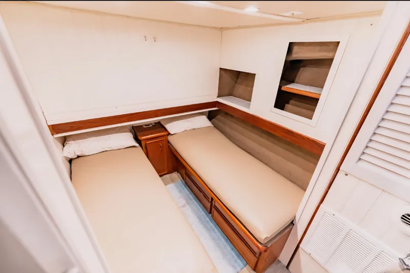  Yacht Photos Pics 1988 Ocean Yachts 48 Super Sport cabin with twin beds and wooden storage.