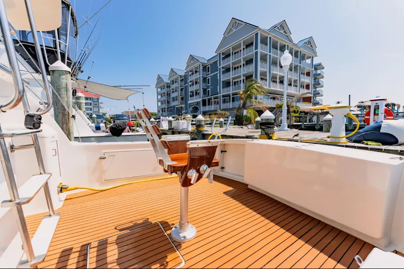  Yacht Photos Pics 1988 Ocean Yachts 48 Super Sport docked, featuring spacious deck and modern marina backdrop.