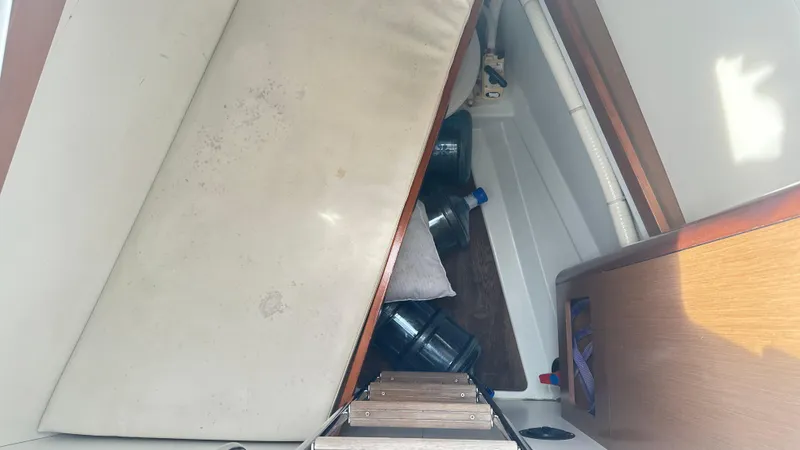  Yacht Photos Pics Interior view of a 2010 Beneteau Oceanis 50 sailboat showing storage area and equipment.