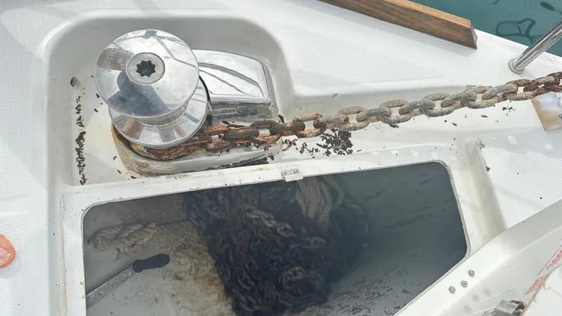  Yacht Photos Pics Anchor chain and windlass on a 2010 Beneteau Oceanis 50 sailboat deck.