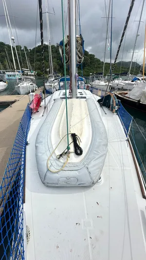  Yacht Photos Pics Beneteau Oceanis 50 sailboat docked, 2010 model, with inflatable dinghy on deck.