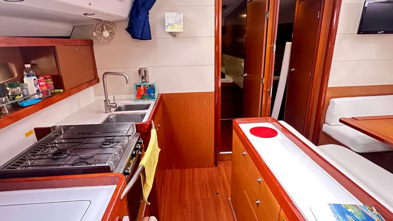  Yacht Photos Pics Interior of 2010 Beneteau Oceanis 50 yacht, featuring kitchen and dining area.