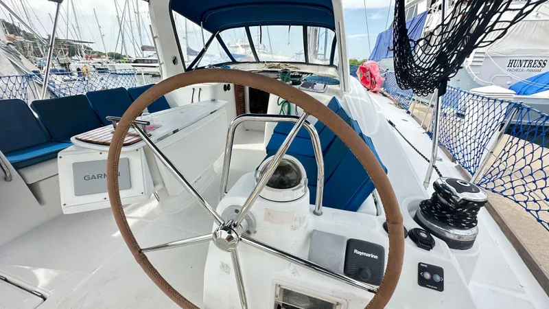  Yacht Photos Pics Cockpit of 2010 Beneteau Oceanis 50 sailboat with steering wheel and navigation equipment.