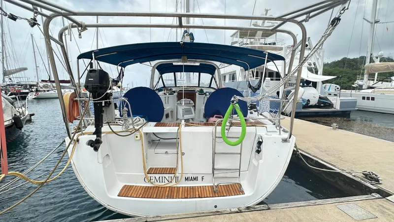  Yacht Photos Pics 2010 Beneteau Oceanis 50 sailboat docked at marina, rear view.