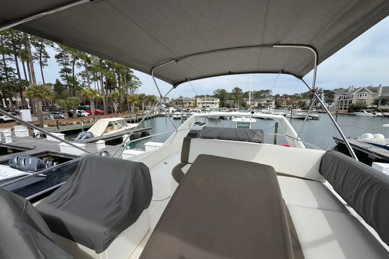  Yacht Photos Pics 2014 Prestige 400 yacht docked at marina, featuring spacious deck and canopy.