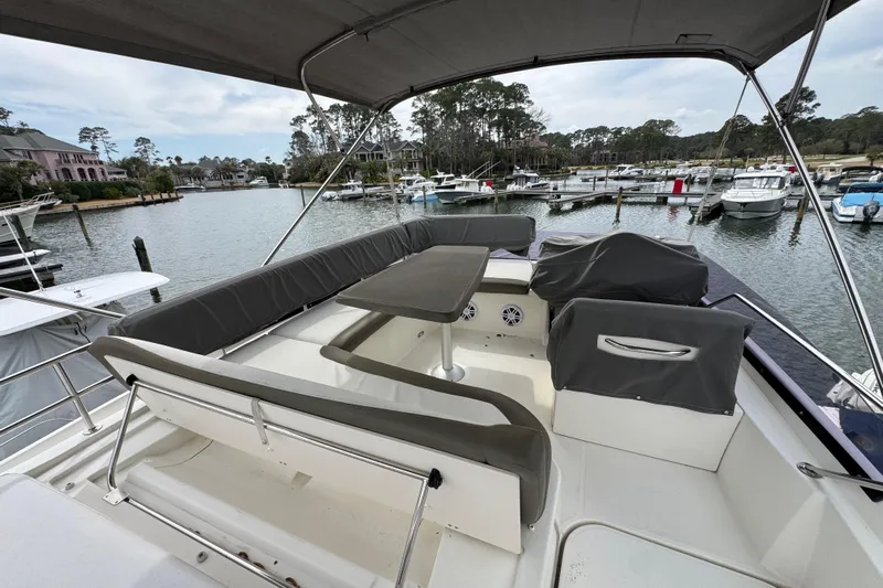  Yacht Photos Pics 2014 Prestige 400 yacht with spacious seating area in a marina setting.