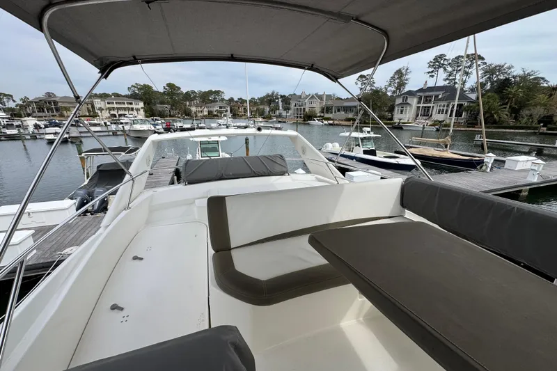  Yacht Photos Pics 2014 Prestige 400 yacht with spacious deck, docked in a scenic marina.