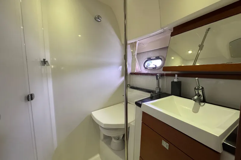  Yacht Photos Pics Luxurious bathroom in 2014 Prestige 400 yacht with modern fixtures and sleek design.
