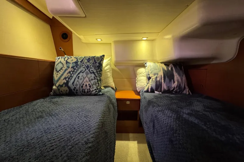  Yacht Photos Pics Cozy twin cabin with blue bedding in a 2014 Prestige 400 yacht.