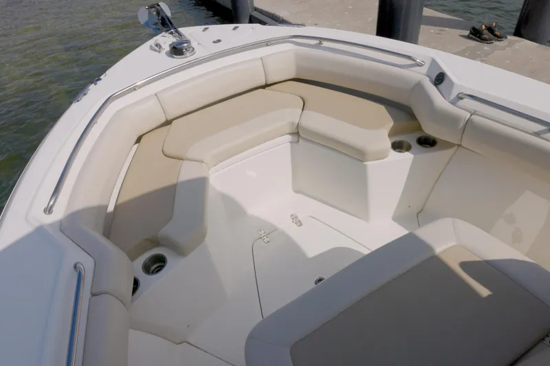 250 Outrage Yacht Photos Pics 2022 Boston Whaler 250 Outrage boat interior with cushioned seating and cup holders.