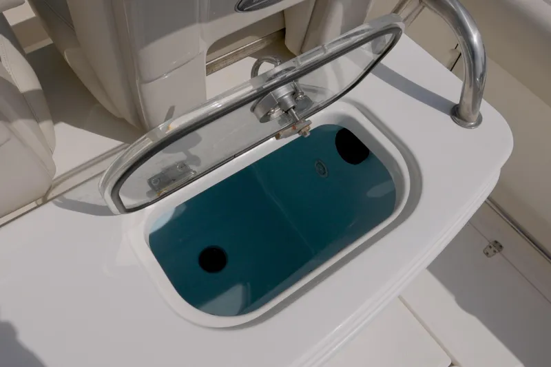 250 Outrage Yacht Photos Pics Livewell on 2022 Boston Whaler 250 Outrage boat, open lid, stainless steel handle.