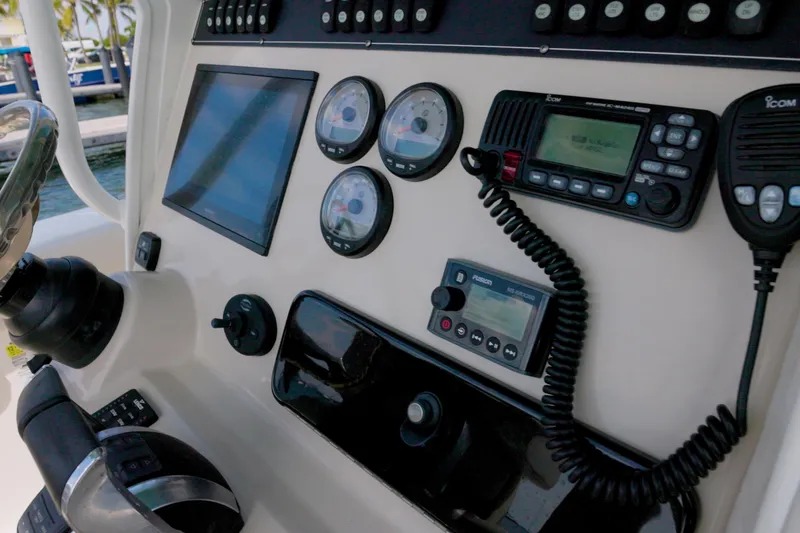 250 Outrage Yacht Photos Pics Control panel of 2022 Boston Whaler 250 Outrage boat with gauges and communication devices.