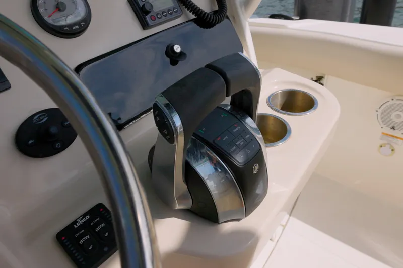 250 Outrage Yacht Photos Pics 2022 Boston Whaler 250 Outrage boat console with controls and cup holders.