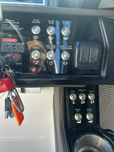  Yacht Photos Pics Control panel of a 2018 Sea Ray SLX 280 boat with various switches and keys.