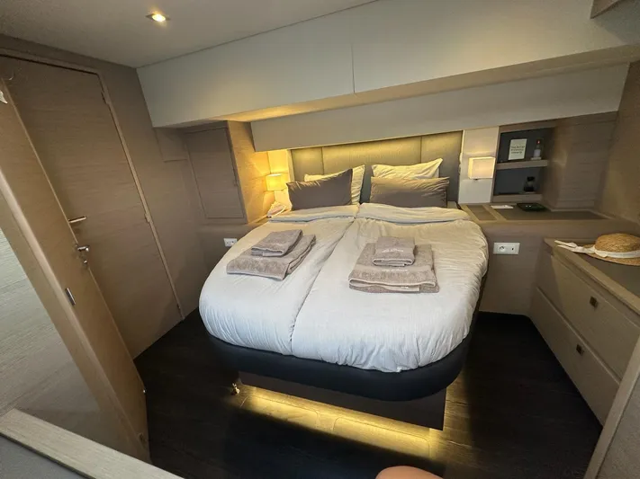  Yacht Photos Pics Luxurious bedroom interior of 2020 Fountaine Pajot Samana 59 yacht with cozy bedding.