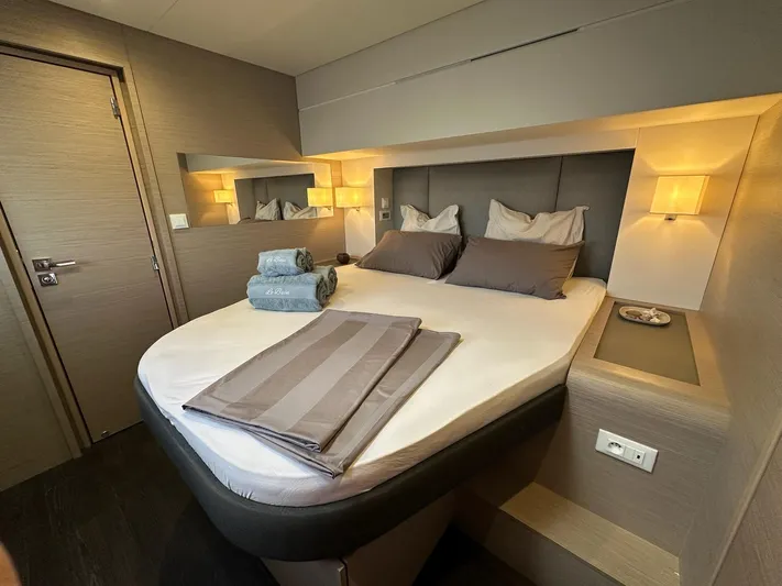  Yacht Photos Pics Luxurious bedroom interior of 2020 Fountaine Pajot Samana 59 yacht with elegant bedding.