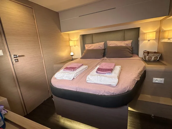  Yacht Photos Pics Luxurious bedroom interior of 2020 Fountaine Pajot Samana 59 yacht with cozy bedding.
