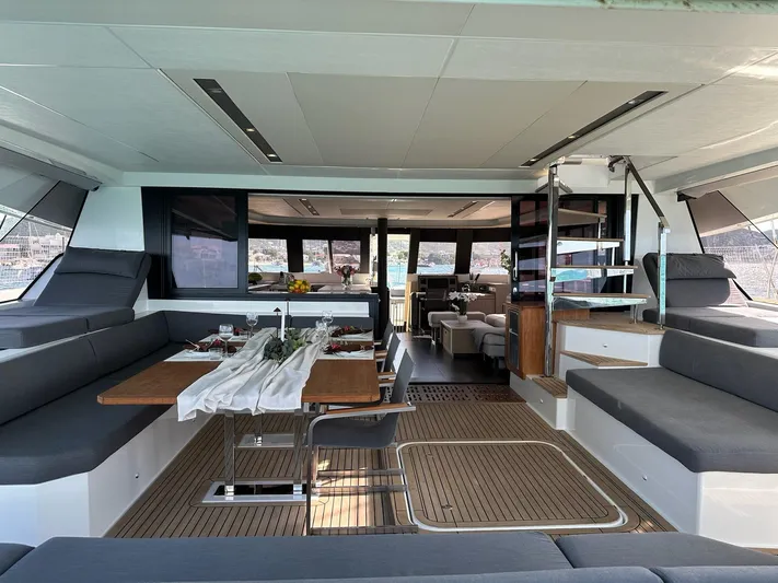  Yacht Photos Pics Luxurious interior of 2020 Fountaine Pajot Samana 59 yacht with elegant dining area.