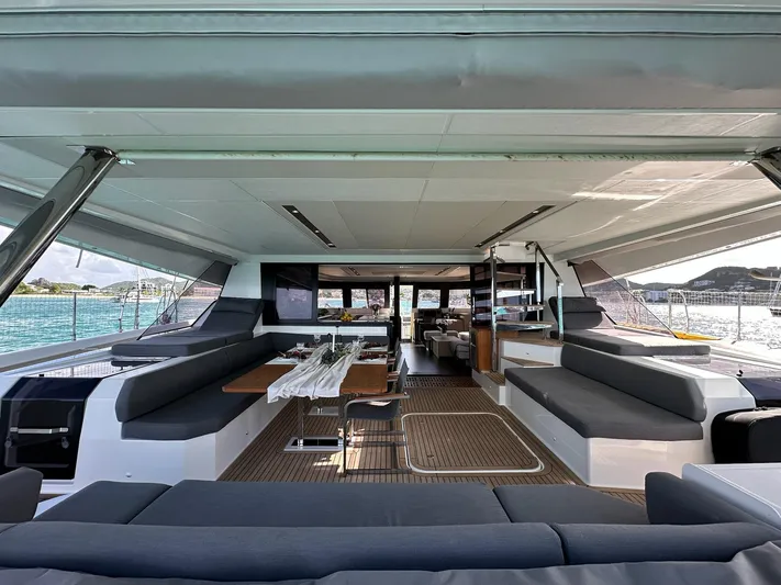  Yacht Photos Pics Spacious interior of 2020 Fountaine Pajot Samana 59 yacht with elegant seating and dining area.