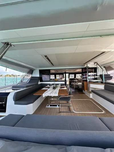  Yacht Photos Pics Spacious interior of 2020 Fountaine Pajot Samana 59 yacht with modern seating and dining area.
