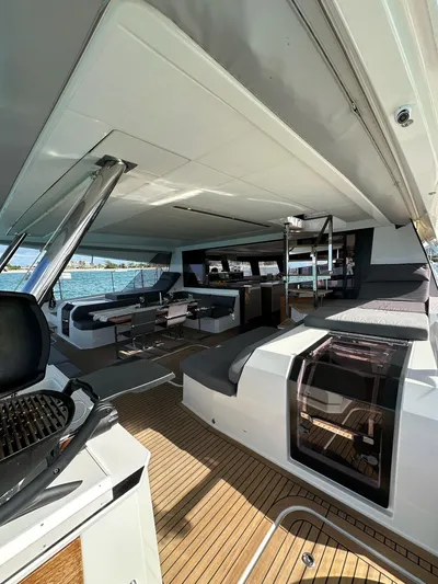  Yacht Photos Pics Spacious deck of 2020 Fountaine Pajot Samana 59 yacht with modern seating and ocean view.