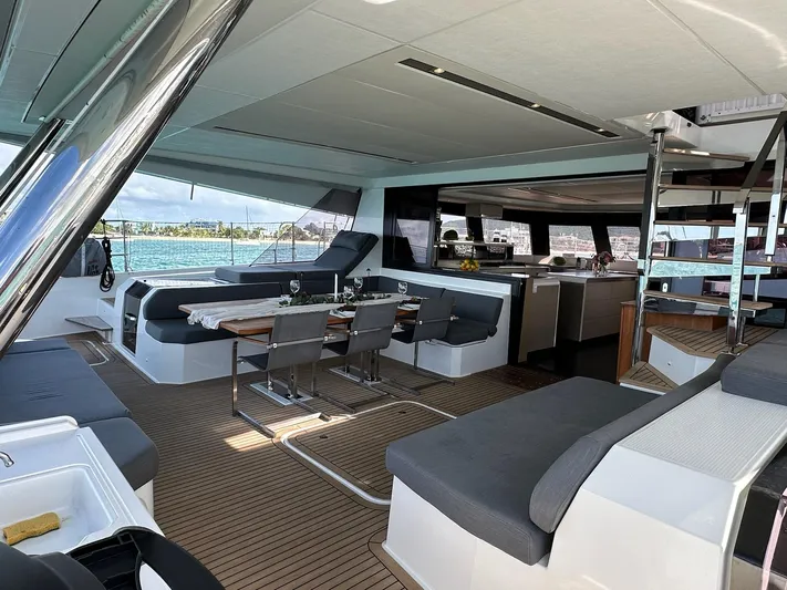  Yacht Photos Pics Luxurious interior of 2020 Fountaine Pajot Samana 59 yacht with modern seating and dining area.