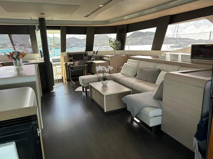  Yacht Photos Pics Luxurious interior of 2020 Fountaine Pajot Samana 59 yacht with modern furnishings and panoramic views.
