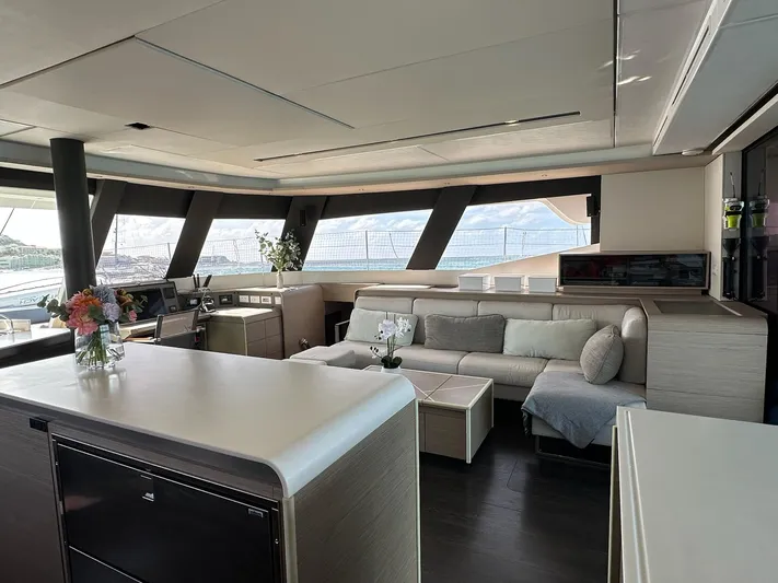  Yacht Photos Pics Luxurious interior of 2020 Fountaine Pajot Samana 59 yacht with modern furnishings and panoramic windows.