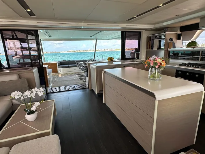  Yacht Photos Pics Luxurious interior of 2020 Fountaine Pajot Samana 59 yacht with modern kitchen and ocean view.