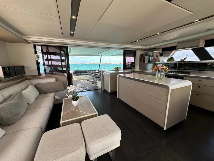  Yacht Photos Pics Luxurious interior of 2020 Fountaine Pajot Samana 59 yacht with modern furnishings and ocean view.