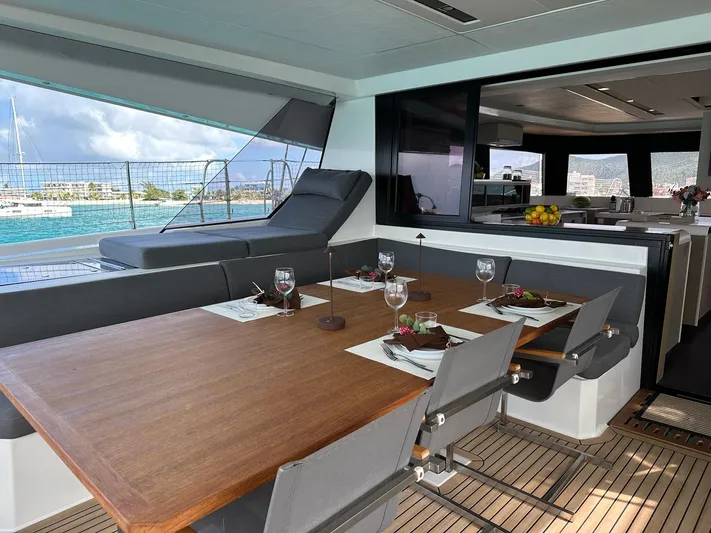  Yacht Photos Pics Luxurious dining area on 2020 Fountaine Pajot Samana 59 yacht, featuring elegant table settings.