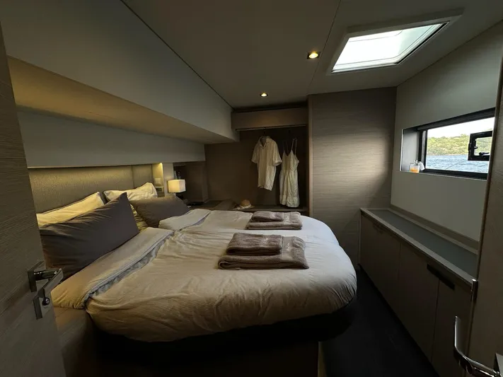  Yacht Photos Pics Luxurious bedroom interior of 2020 Fountaine Pajot Samana 59 yacht with cozy bedding.