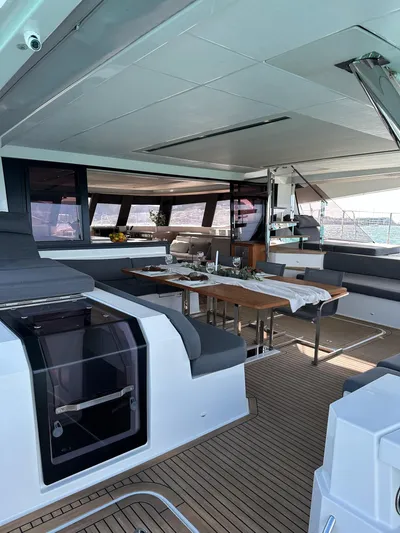  Yacht Photos Pics Luxurious interior of 2020 Fountaine Pajot Samana 59 catamaran with elegant dining area.