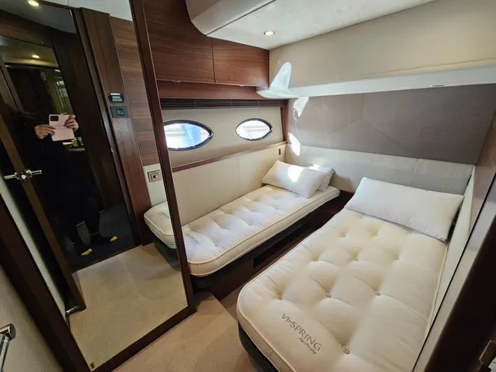  Yacht Photos Pics Luxurious twin cabin in 2013 Princess 52 Flybridge yacht with plush bedding and modern design.
