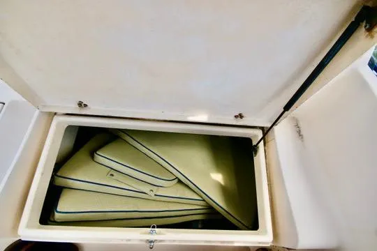 Solasta Yacht Photos Pics Storage compartment with cushions on a 1997 Island Packet 350 sailboat.