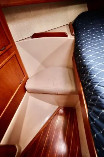 Solasta Yacht Photos Pics 1997 Island Packet 350 cabin interior with wooden flooring and cushioned seating.