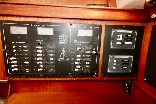 Solasta Yacht Photos Pics Electrical control panel on a 1997 Island Packet 350 yacht, featuring 12V DC and 110V AC systems.