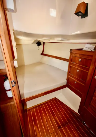 Solasta Yacht Photos Pics Cozy cabin interior of 1997 Island Packet 350 sailboat with wooden furnishings.