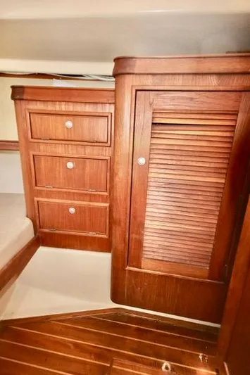 Solasta Yacht Photos Pics Interior of 1997 Island Packet 350 sailboat with wooden cabinetry and flooring.
