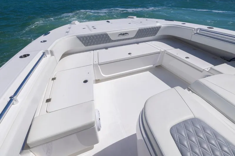  Yacht Photos Pics 2023 Invincible 37 Catamaran deck with seating, on open water.