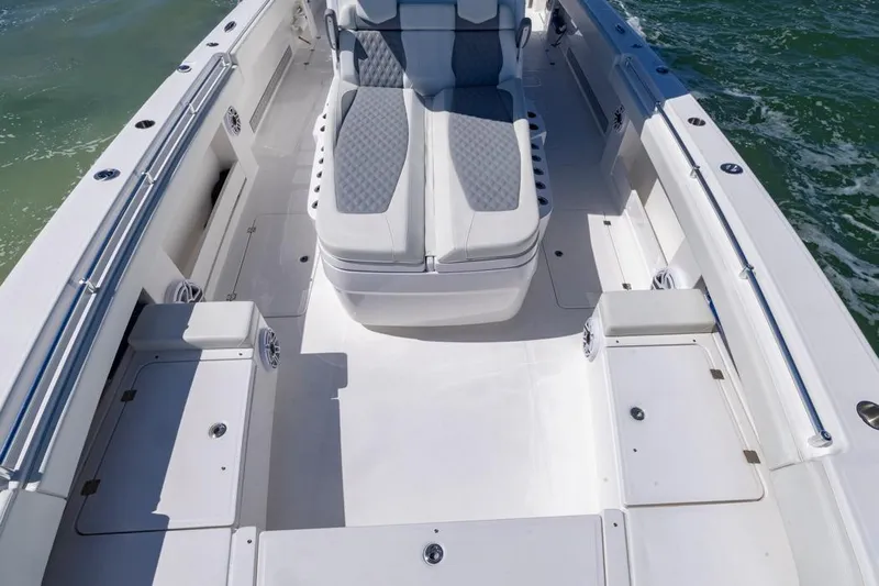  Yacht Photos Pics 2023 Invincible 37 Catamaran interior with spacious seating and storage on open water.